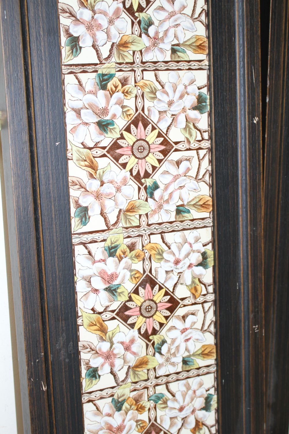 A pair of Victorian apple blossom tile panels and a set of six Art Nouveau foliate design tiles, all framed